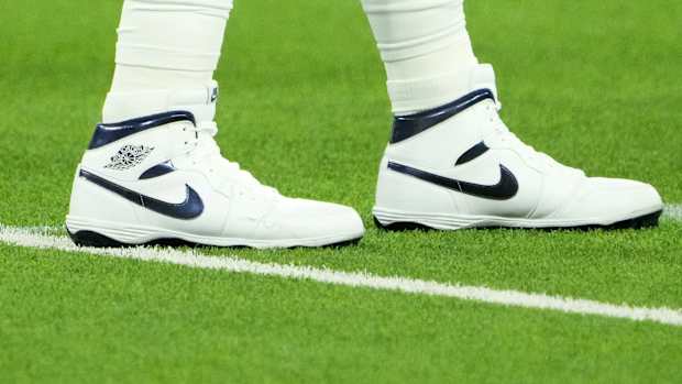 View of Dallas Cowboys quarterback Dak Prescott's white and blue Air Jordan cleats.